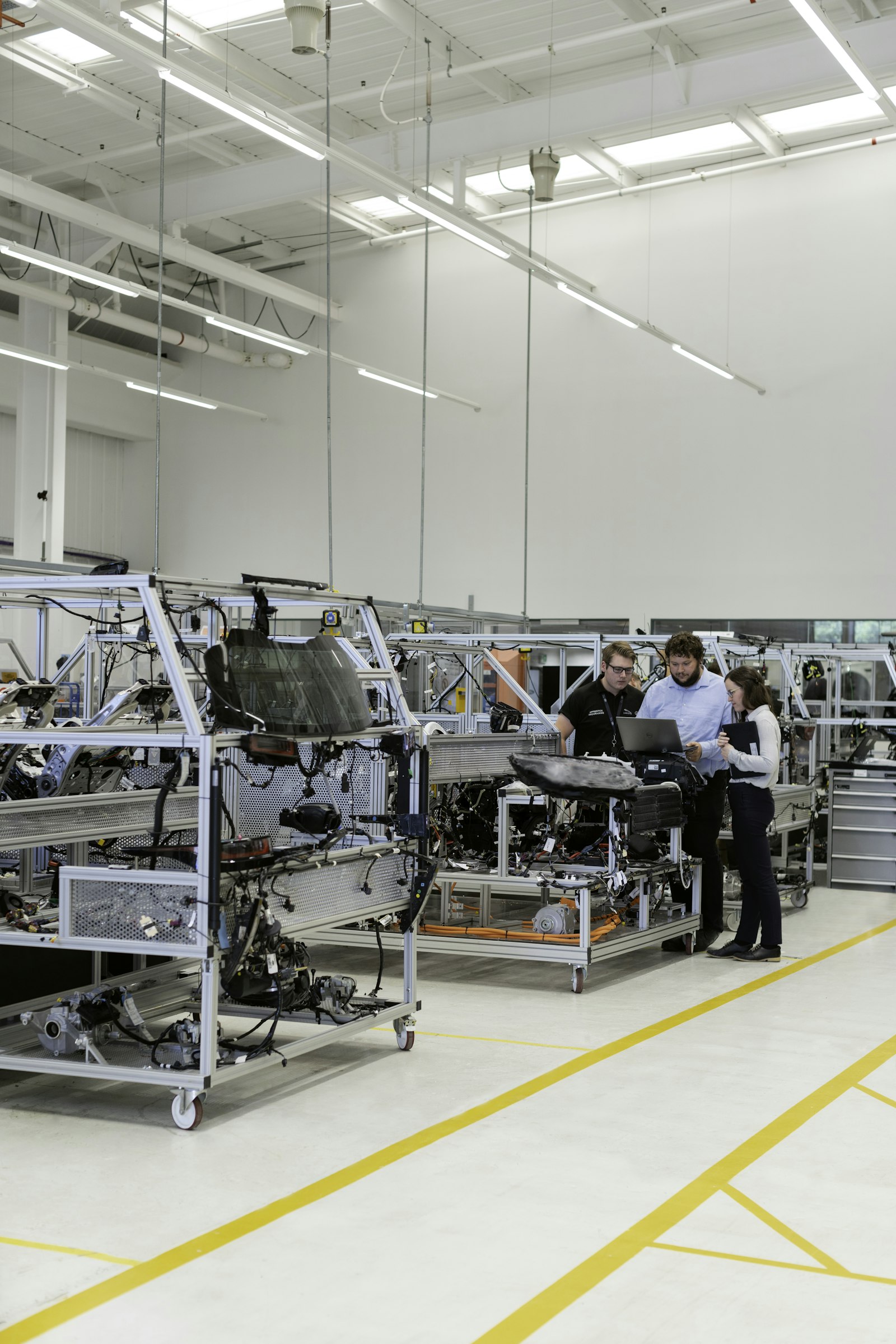 Engineers on an integrated electronics production floor