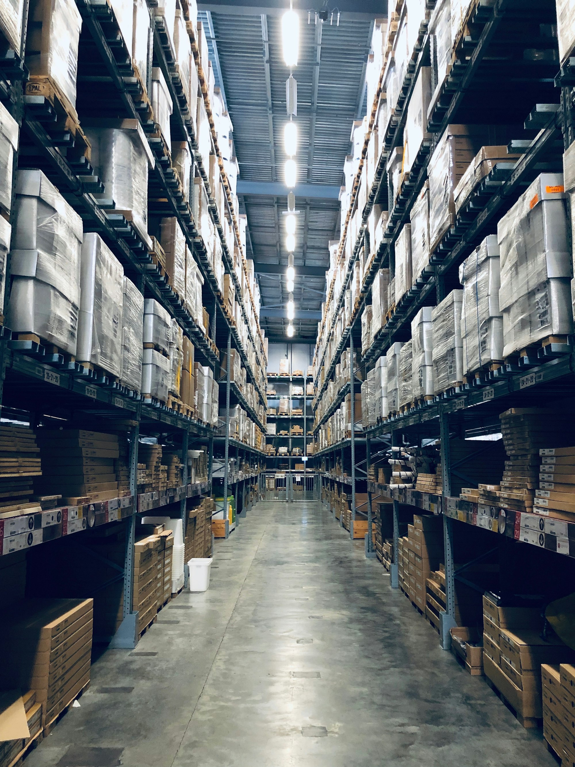 Warehouse storage aisle with stacked pallets